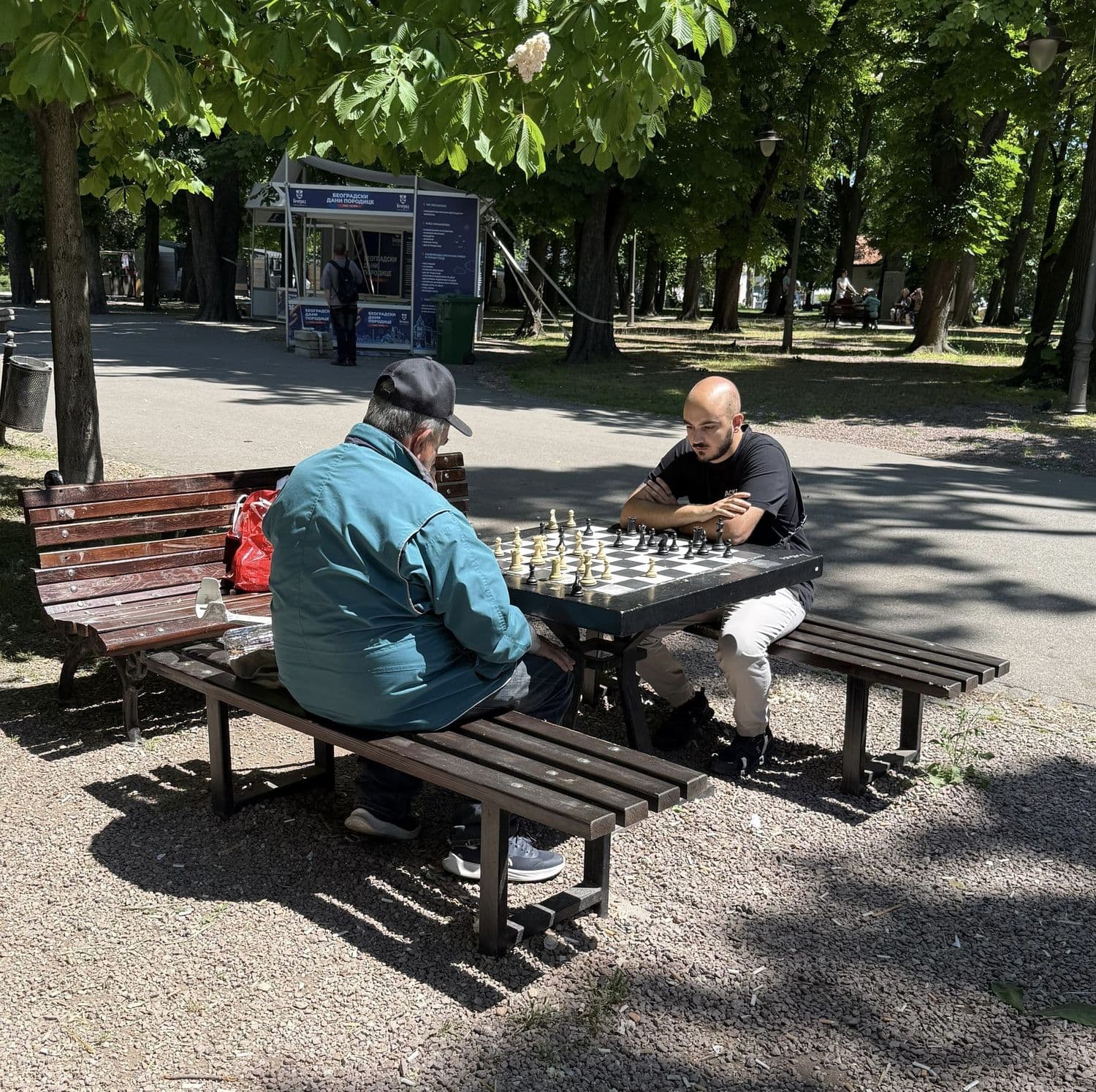 Lucas playing chess in a park in Belgrade