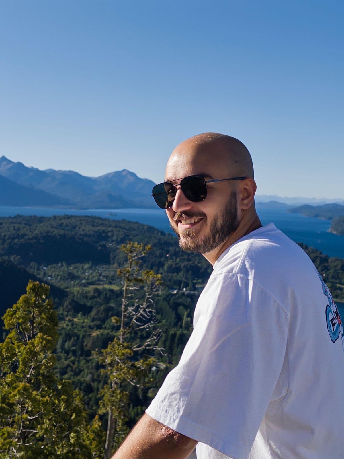 Lucas above the lakes and mountains of Bariloche, Argentina